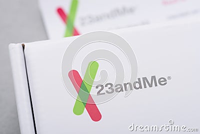 23andMe logo closeup on personal genetic test saliva collection kit Editorial Stock Photo