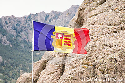 Andorranian Flag on rocky Mountains Stock Photo