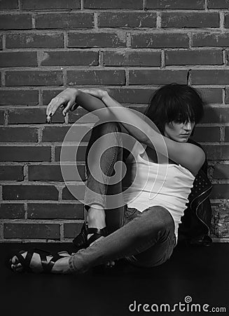 Androgyny female model in Heroin chic style. Stock Photo