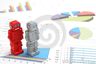 Android robots or artificial intelligence and graphs are written documents on white background. Stock Photo