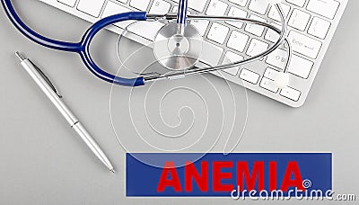 ANEMIA word with Stethoscope on keyboard on grey background Stock Photo