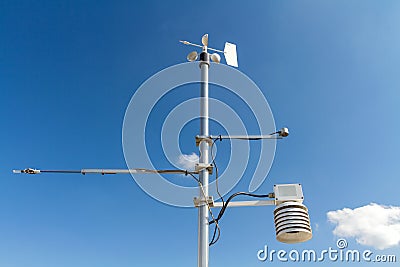 Anemometer, temperature and humidity meteorological instrument on the pole Stock Photo