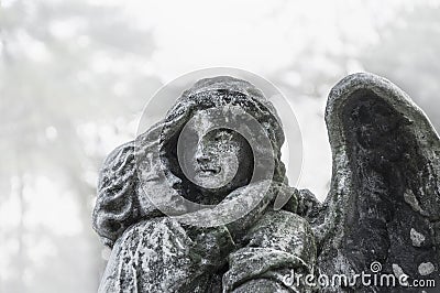 Angel with childin her arms Azrael, Azriel, Malak al-maut, concept of death Stock Photo