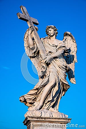 Angel with the Cross statue on Ponte Sant`Angelo Saint Angel Bridge over Tiber river in historic center of Rome in Italy Editorial Stock Photo