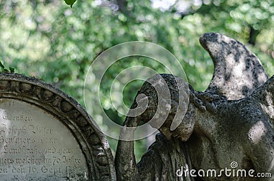 angel figure at a grave detail Stock Photo