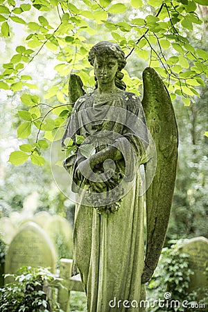 Angel Grave Sculpture in Cemetery - 3 Editorial Stock Photo