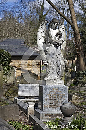 Angel on gravestone at Hampstead Cemetery, London Editorial Stock Photo