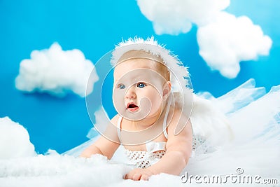 The baby as the angel soaring in clouds Stock Photo