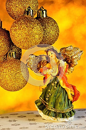 Angel Holiday Christmas balls decorated with a Golden background with bright bokeh lights. Winter Christmas holiday give gifts, Stock Photo