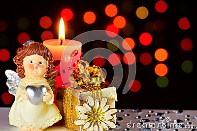 Angel of love Cupid, gift, pink candle and rainbow lights festive background with hearts and bright lights Stock Photo