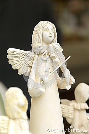 Angel playing the violin Stock Photo
