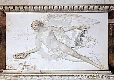 Angel relief on marble tomb in a graveyard, Italy Stock Photo