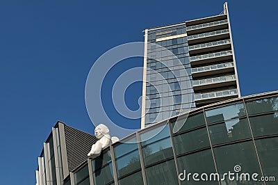 Angel sculpture at modern steel and glass skyscraper, financial center of Vilnius Editorial Stock Photo