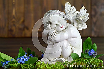 Angel and spring flowers Stock Photo