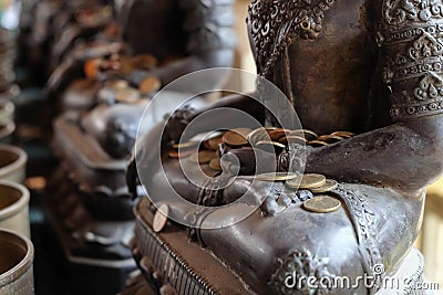 Angel statue and monk's alms bowl with put the coins Stock Photo