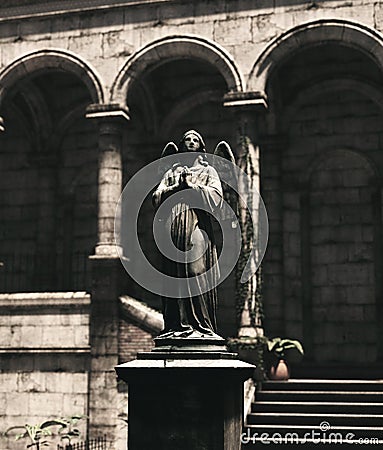 An angel statue in ruins place Stock Photo