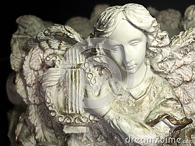 Angelic lyre player in performance Stock Photo