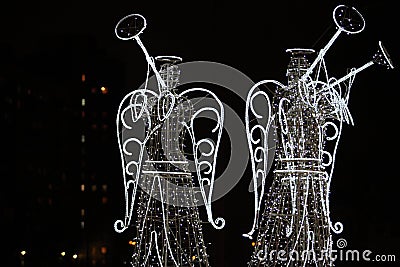 Angels in the night city Stock Photo