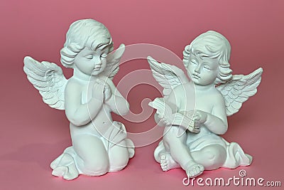 Angels on pink background Stock Photo