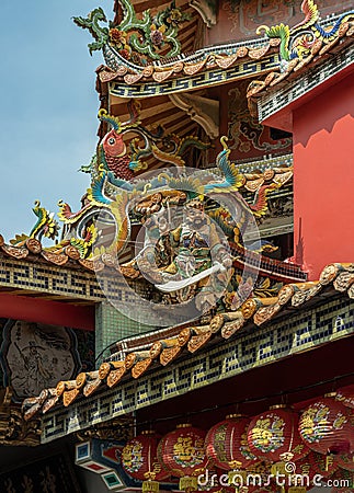 Angels statues and Dragons sculpture decorate on Taiwanese temple roof Stock Photo