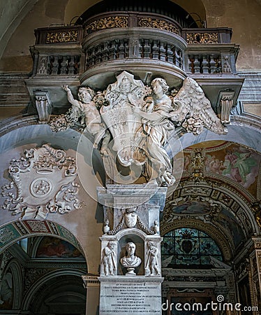 Angels supporting the emblem of Pope Alexander VII, in the Basilica of Santa Maria del Popolo in Rome, Italy. Stock Photo