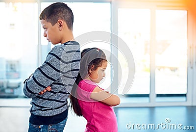 Anger, brother and sister in home living room, fighting or argument, conflict or problem. Angry, children and kids with Stock Photo