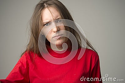 Anger and rage concept. Young expressive woman show her bad face. Angry nervous annoyed girl portrait. Human full of negative emot Stock Photo
