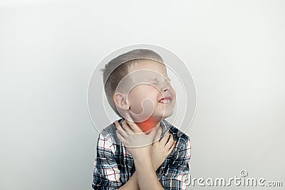 A pediatrician examines a boy who complains of a sore throat. Diagnosis of tracheal diseases. Angina, tonsillitis, pharyngitis, Stock Photo