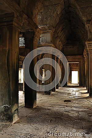 Angkor, Cambodia. Stone corridor and pillars Stock Photo