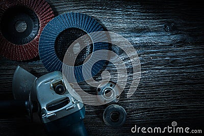 Angle grinder radial sanding discs on vintage wooden board Stock Photo