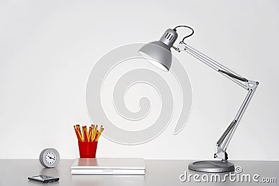 Angle Poise Lamp On Office Desk Stock Photo