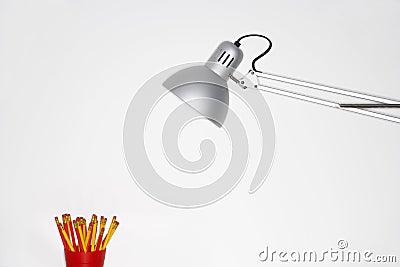 Angle Poise Lamp And Pencil Holder Stock Photo