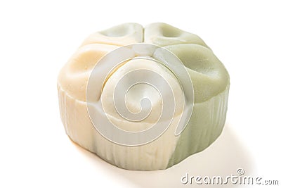 trendy and beautiful flower shape green and white colors moon cake on a white background Stock Photo