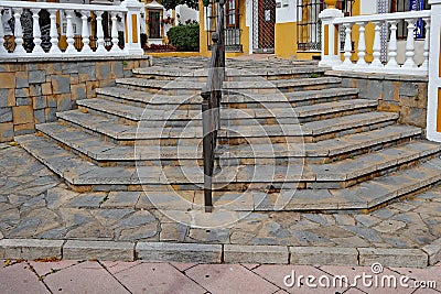 Angled steps lead from the road to a shopping area in Estepona, Spain Stock Photo