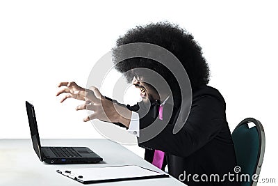Angry African businessman with laptop Stock Photo