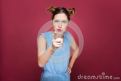 Angry amusing young woman pointing on you Stock Photo