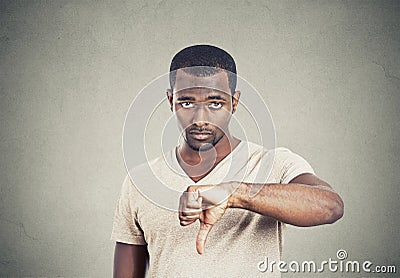 Angry annoyed, grumpy man giving thumbs down gesture Stock Photo