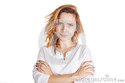 Angry annoyed young housewife keeping arms crossed and staring at camera with sceptical and distrustful look, feeling Stock Photo