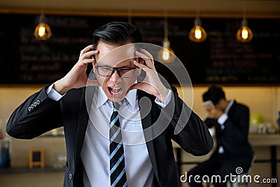 Angry Asian businessman manager shout Stock Photo