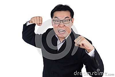 Angry Asian Chinese man wearing suit and holding both fist Stock Photo