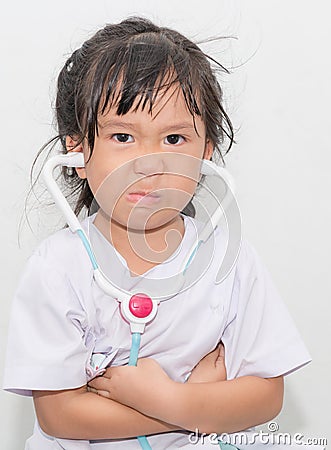 Angry asian girl in doctor costume. Stock Photo