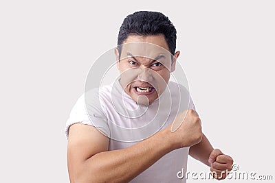 Angry Asian Man Expression Ready to Fight Stock Photo