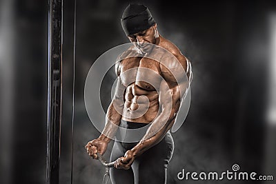 Angry athlete trains in the gym Stock Photo