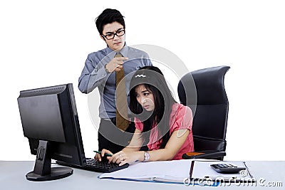 Angry boss bullying a woman Stock Photo