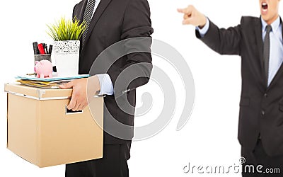 An angry boss firing a man and carrying belongings Stock Photo