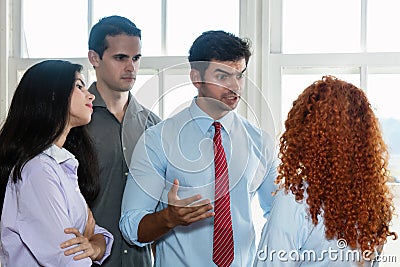 Angry boss talking to lazy employee Stock Photo