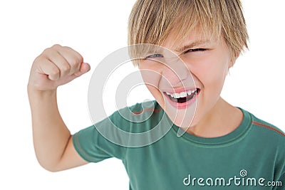 Angry boy tensing arm muscle Stock Photo