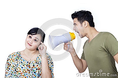 Angry boyfriend using speaker - isolated Stock Photo