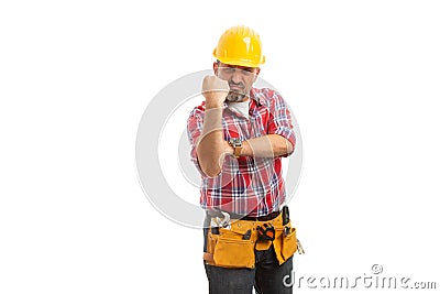 Builder showing fist as obscene gesture Stock Photo