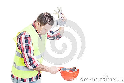 Angry builder throwing his gloves Stock Photo